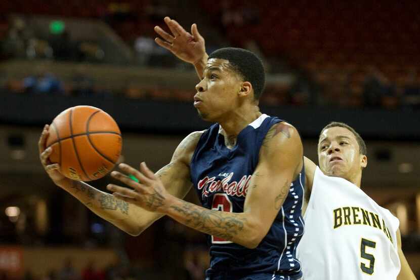 Keith Frazier (2) of Dallas Kimball drives to the basket against San Antonio Northside...