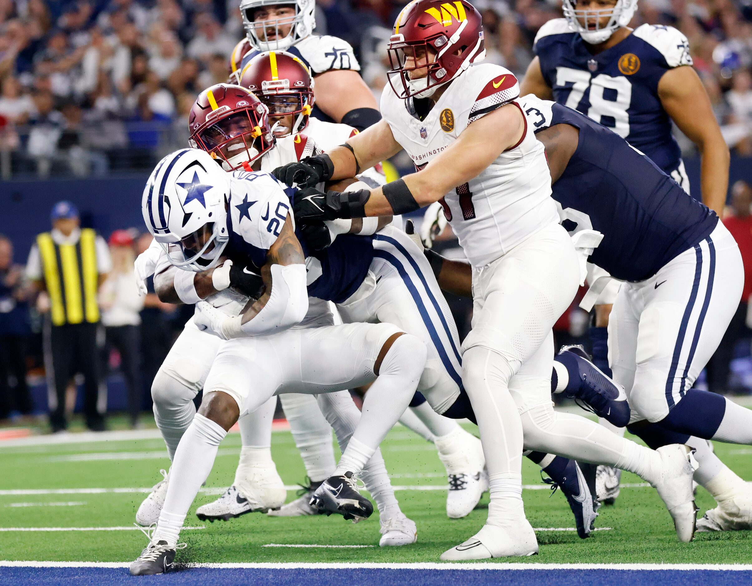 Dallas Cowboys running back Tony Pollard (20) powers his way into the end zone for a second...