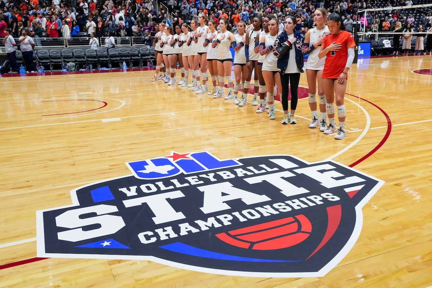 McKinney North players stand for the national anthem before the UIL Class 5A Division I...