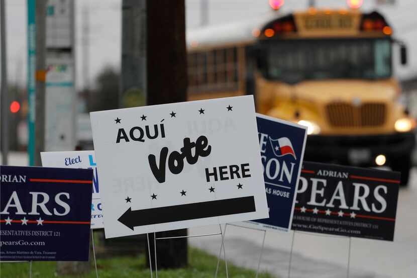  Signs mark a polling site in March 2018 in San Antonio.