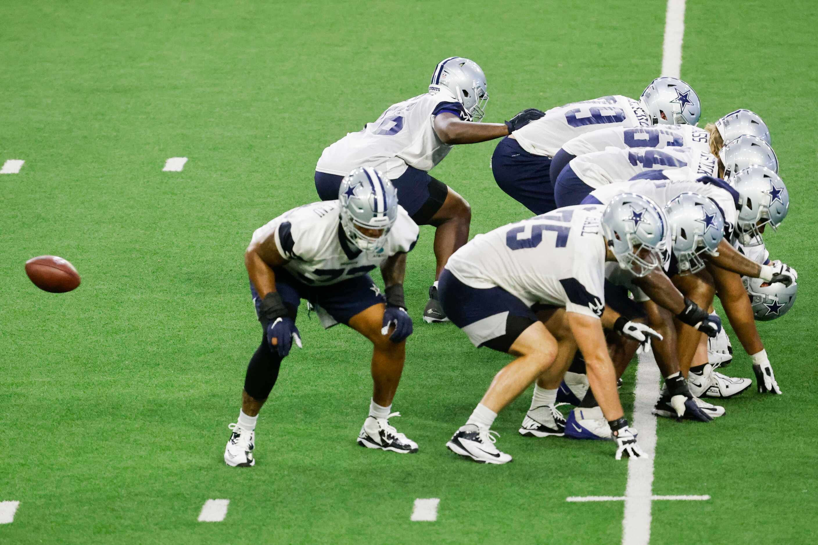 Dallas Cowboys players take part in a drill during a mini camp session at The Star in Frisco...