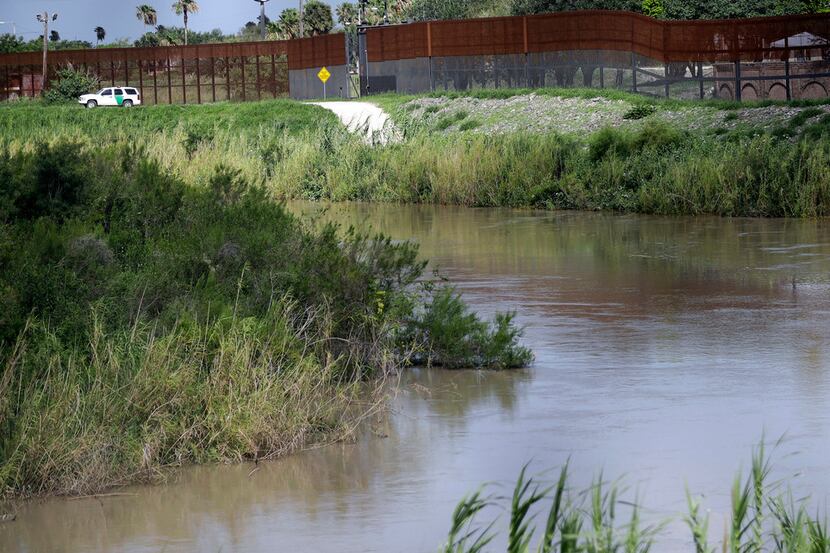In this June 2018 photo, a U.S. Border Patrol vehicle sits above the Rio Grande at the...