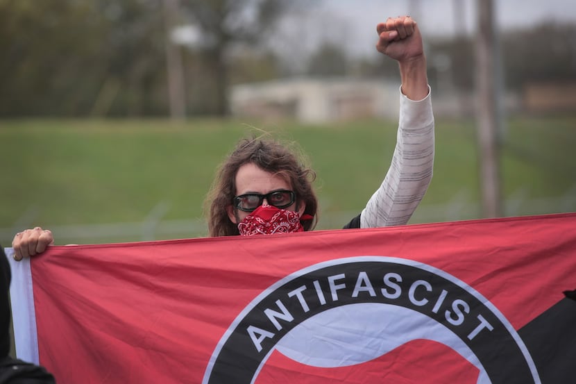 An anti-fascist demonstrator, also known as Antifa, taunted participants as they arrived for...