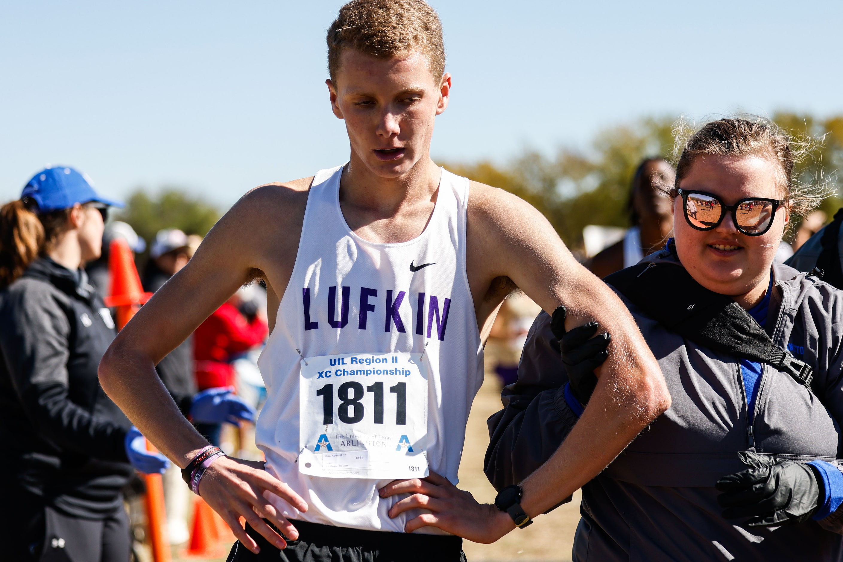 Grant Ashby (1811) from Lufkin team after crossed the finish line during the Class 5A boys...