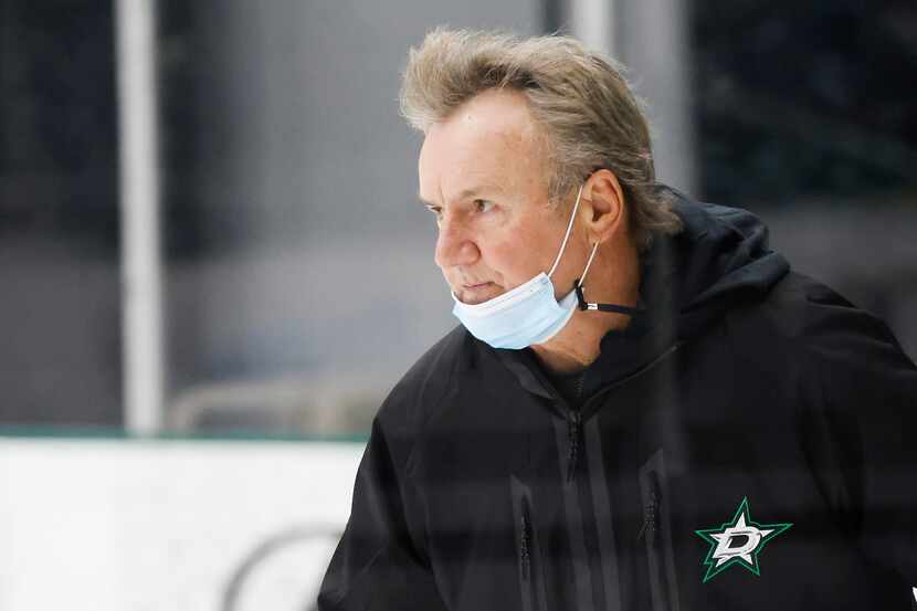 Dallas Stars head coach Rick Bowness watches his team work out during a training camp...