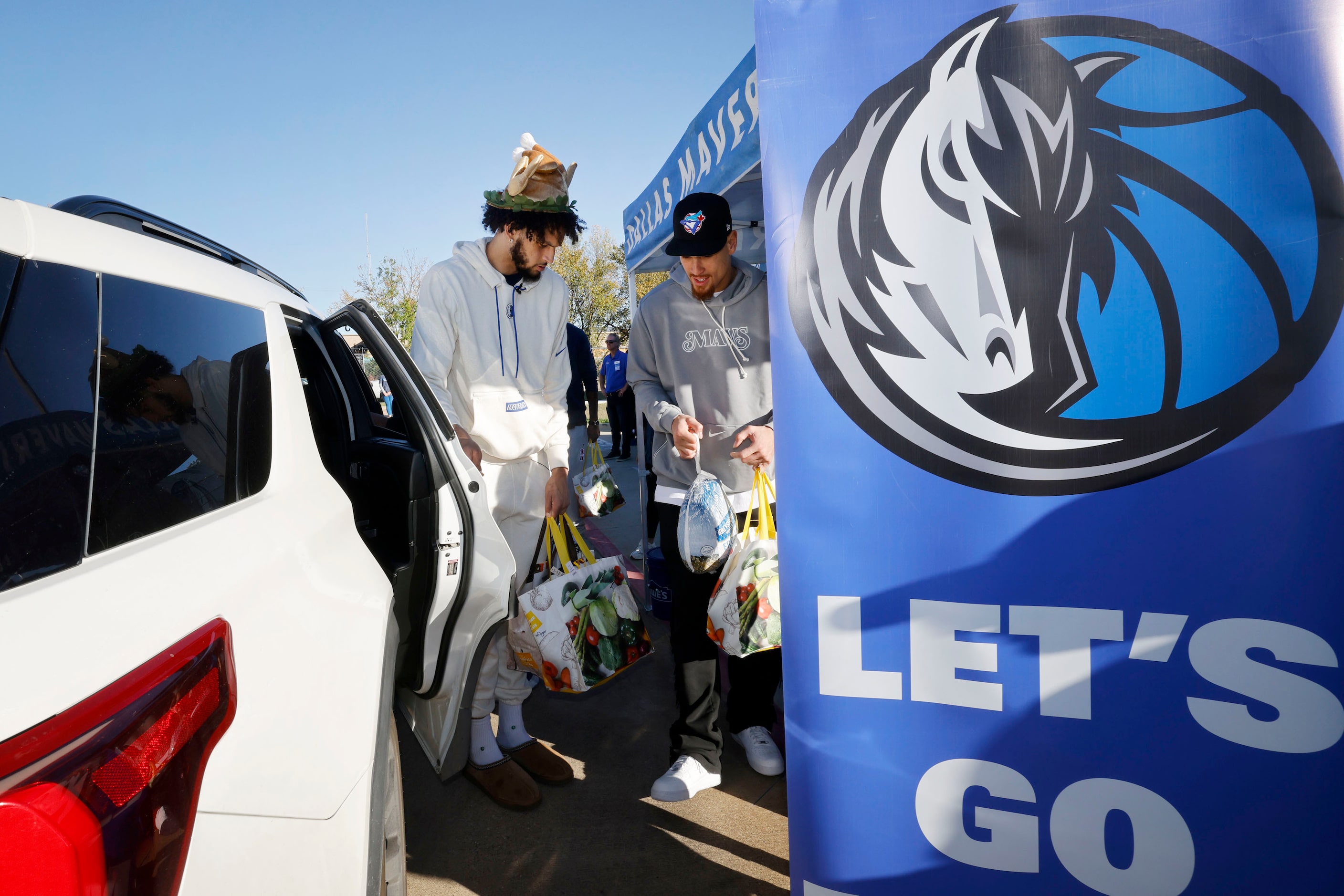 Dallas Mavericks center Dereck Lively II, left, and Dallas Mavericks center Dwight Powell...