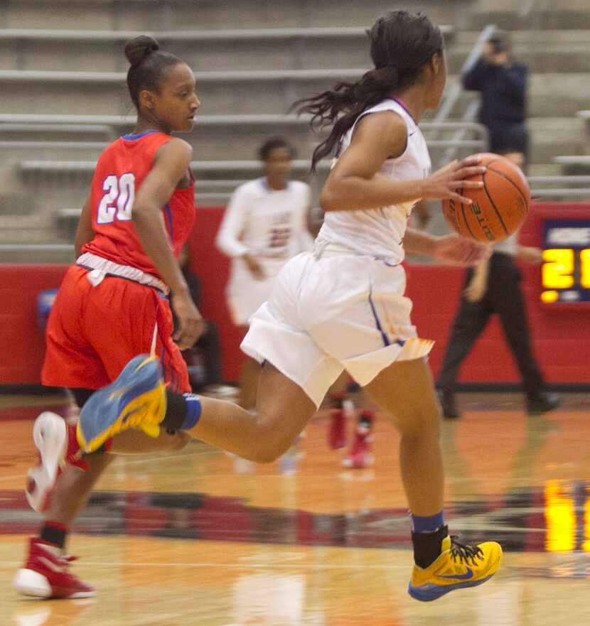 Garland Lakeview Centennial guard Bre' Osha Scott (5) races down the court as Duncanville...