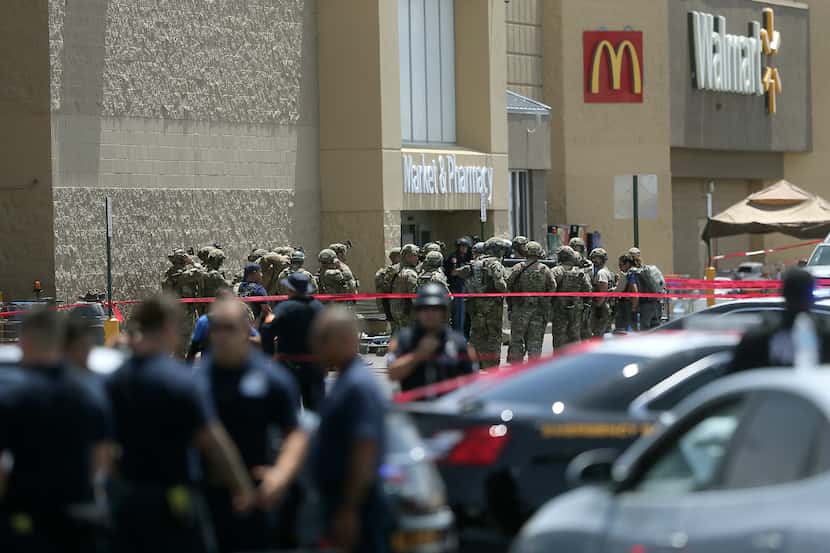 Law enforcement agencies respond to the mass shooting at a Walmart in El Paso on Aug. 3,...