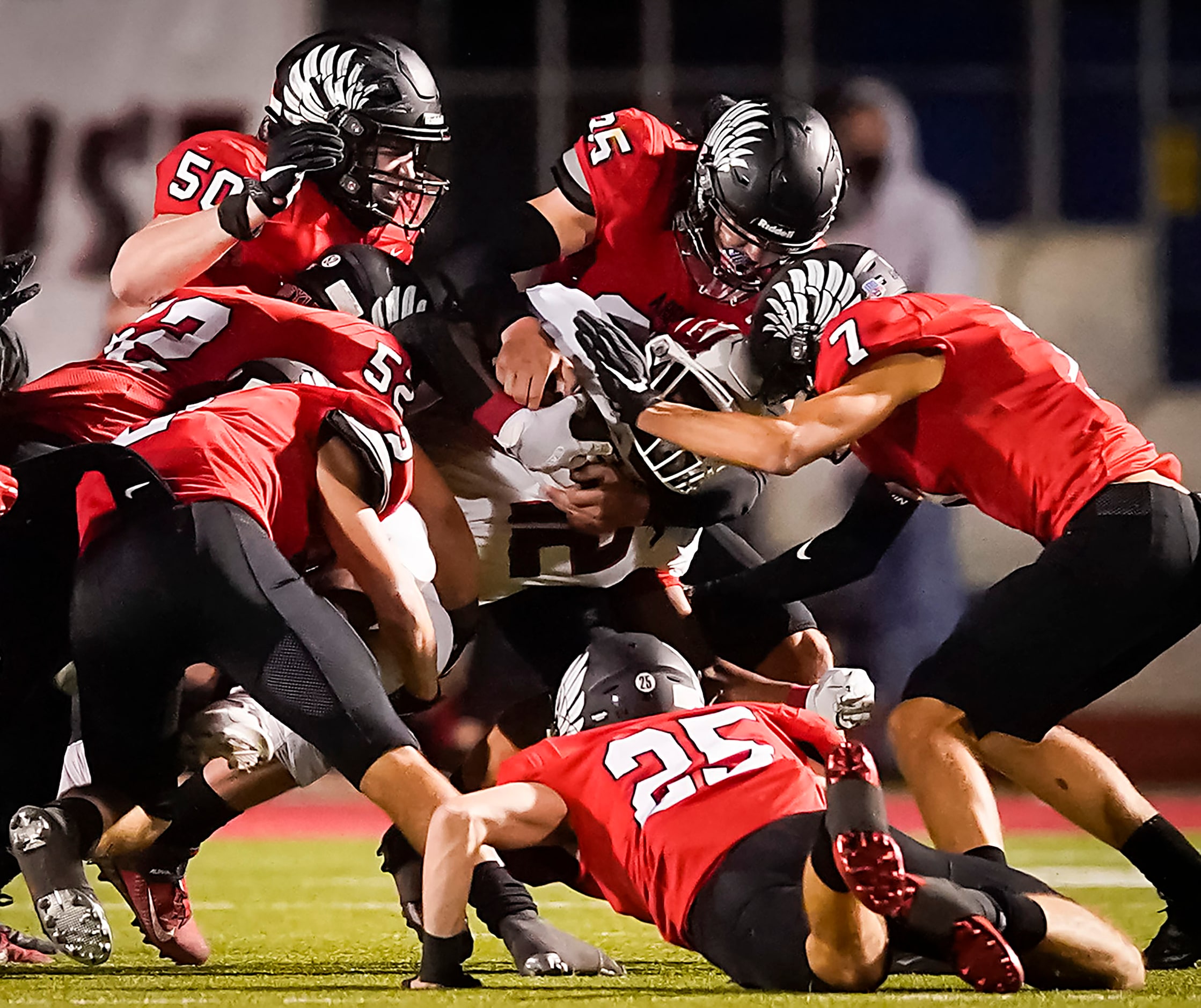 Melissa running back Ashton Mitchell-Johnson (12) is brought down by the Argyle defense...