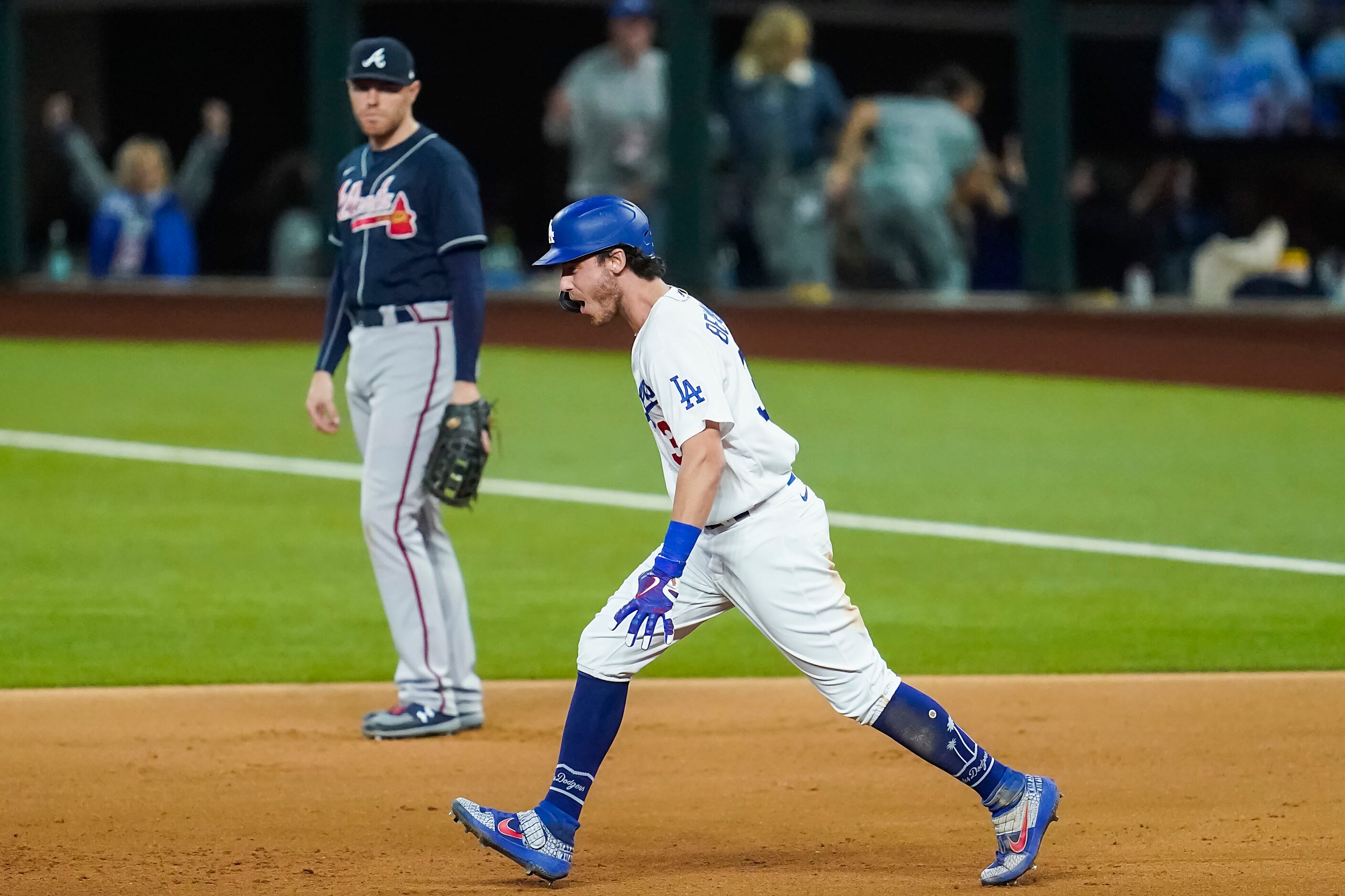 Atlanta Braves first baseman Freddie Freeman watches as Los Angeles Dodgers center fielder...