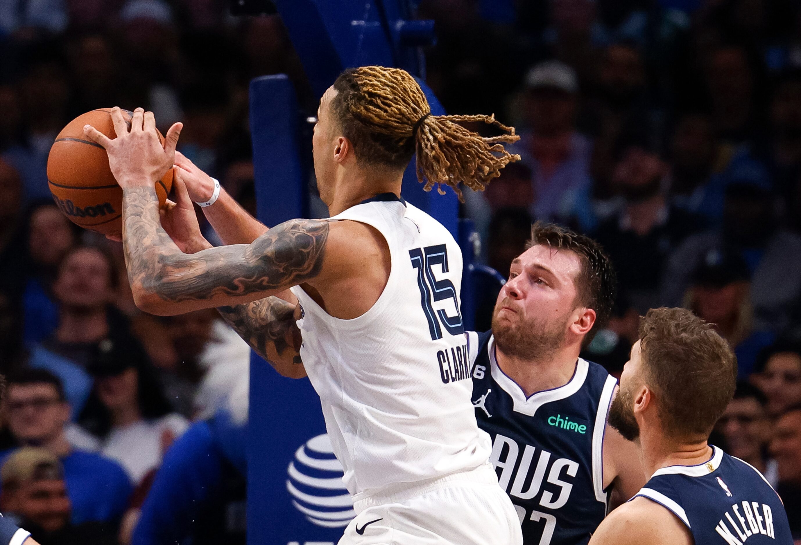 Dallas Mavericks guard Luka Doncic (77) blocks a shot attempt by Memphis Grizzlies forward...