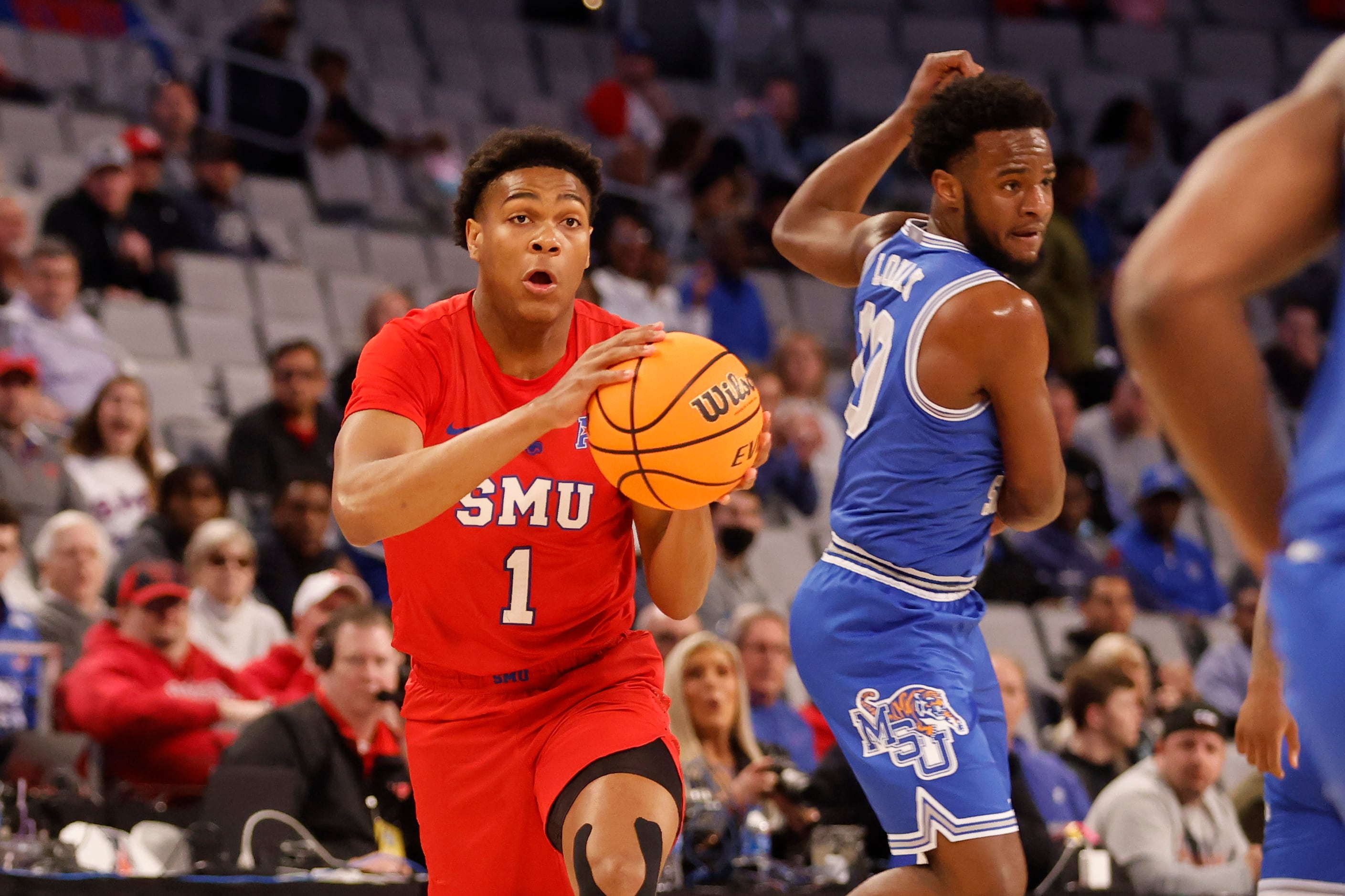 SMU guard Zhuric Phelps (1) steals the ball on a pass to Memphis guard Alex Lomax (10)...