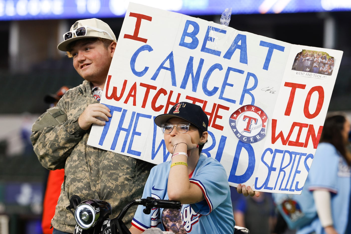 Corianna Jordan along with her brother Connor (right) watches players talk during Texas...