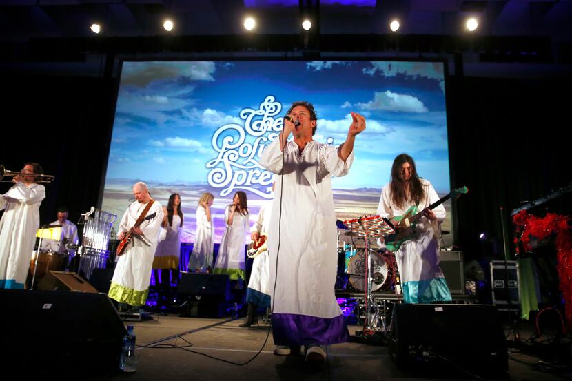 The Polyphonic Spree led by singer Tim DeLaughter (center) formerly of Tripping Daisy,...