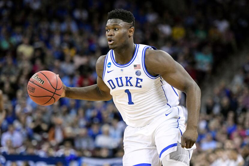 FILE - In this March 24, 2019 file photo, Duke forward Zion Williamson (1) dribbles the ball...