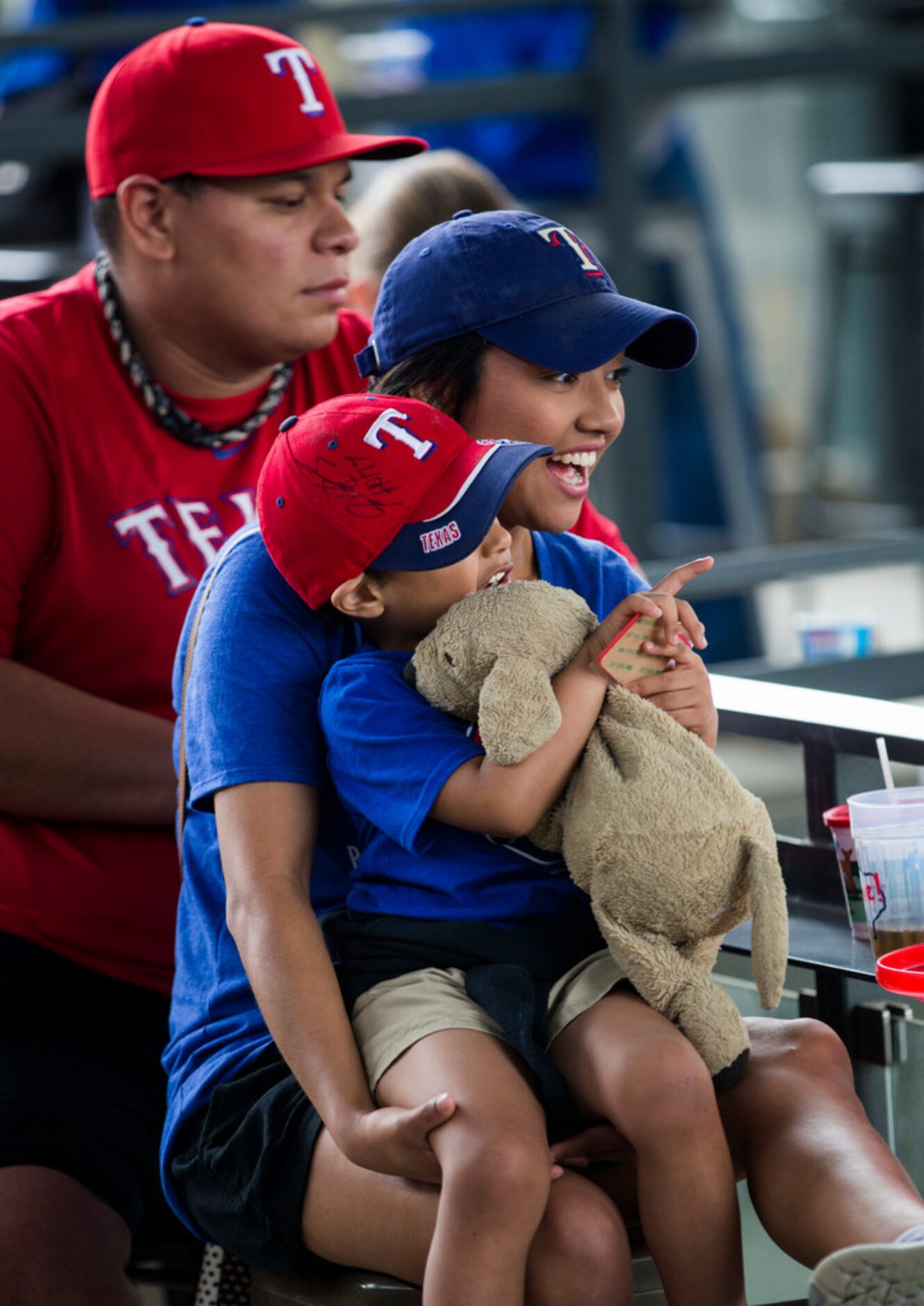 Romario Martinez (left), Jamilet Ovalle (center), Bentley Martinez, 4, and his stuffed dog,...