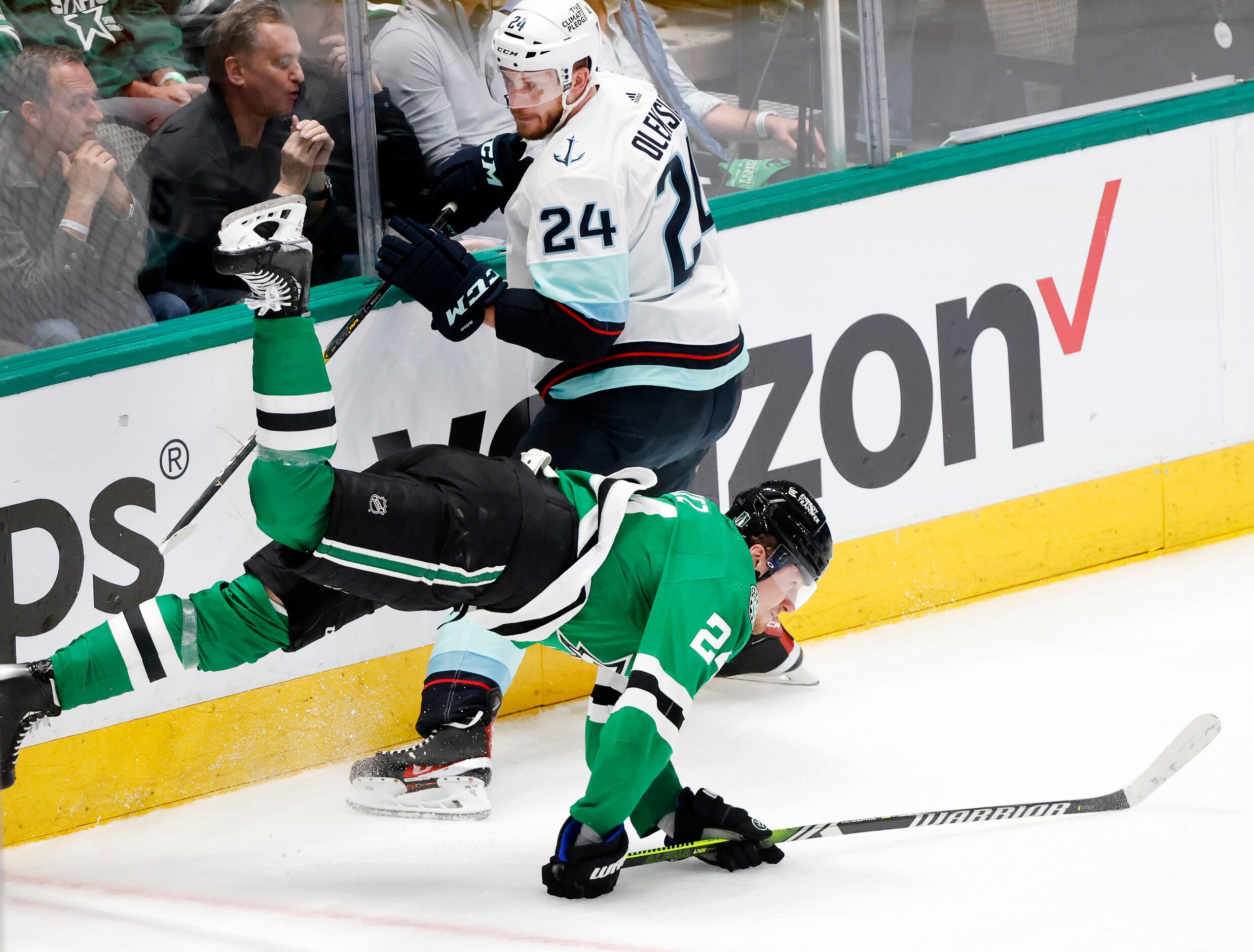 Dallas Stars center Roope Hintz (24) has his feet taken out from under him by Seattle Kraken...