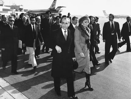 In this Jan. 16, 1979 file picture, Shah Mohammad Reza Pahlavi and Empress Farah walk on the...