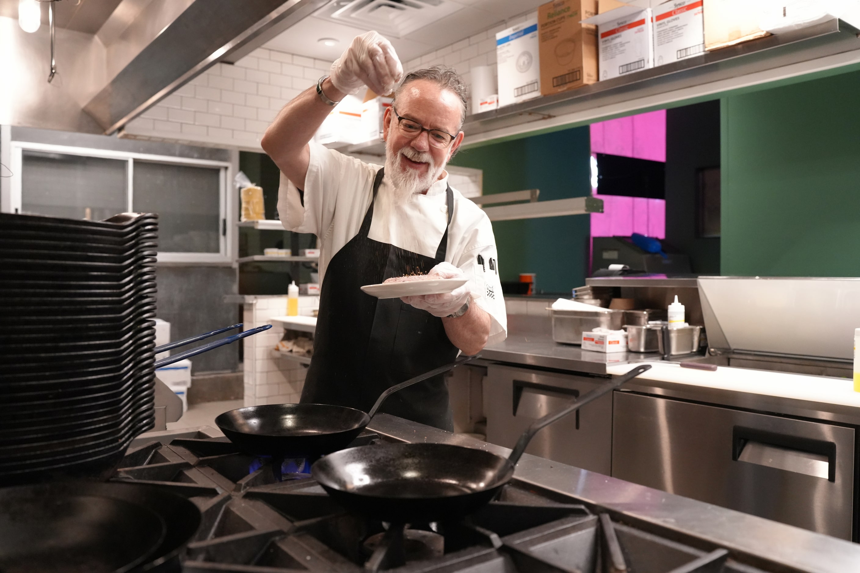 Executive Chef Richard Triptow prepares a dish at Wild Salsa in downtown Dallas on Saturday,...