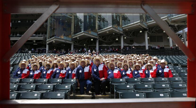 Texas delegates took a group photo in their "uniform" at Progressive Field in Cleveland on...