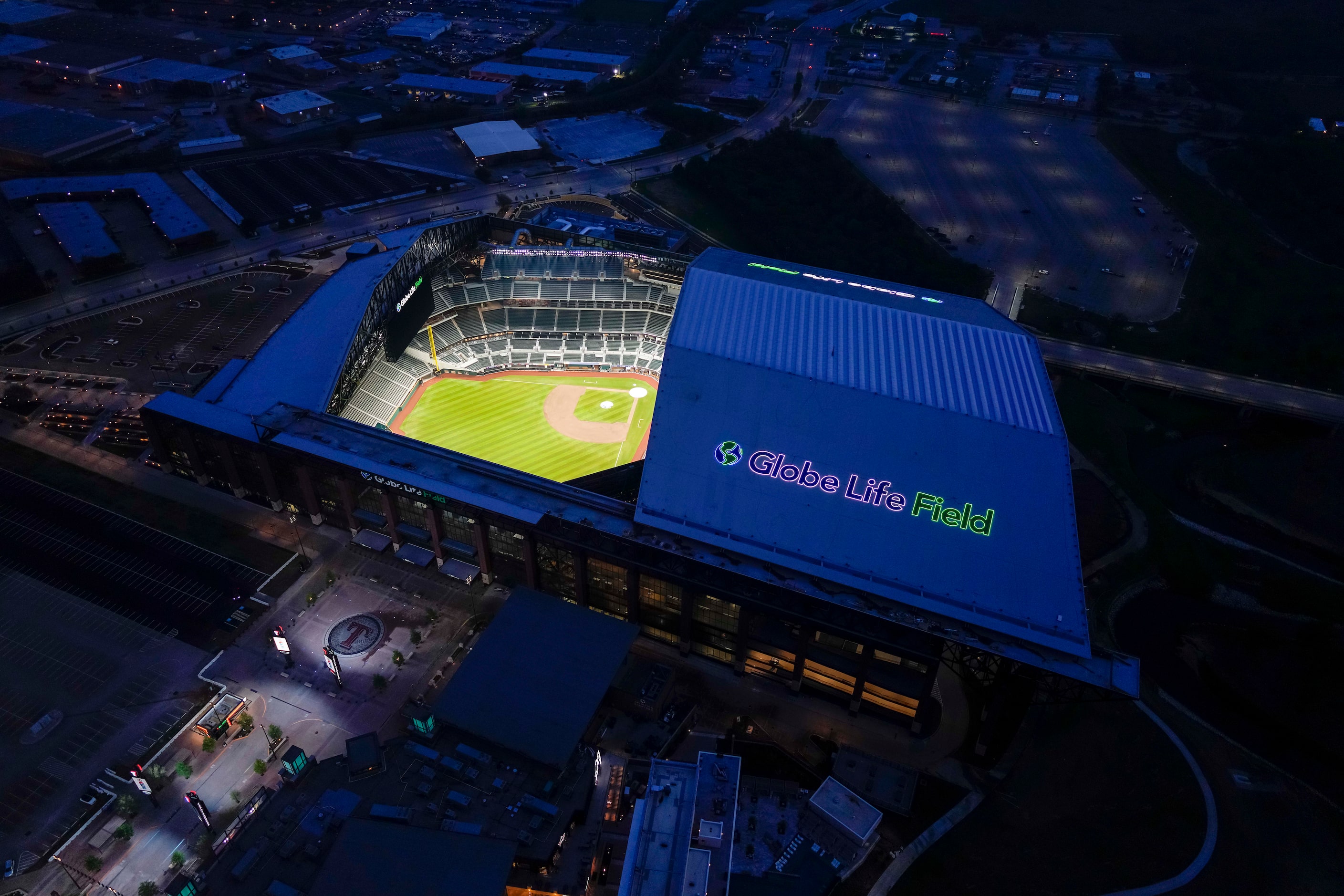 An aerial view of Globe Life Field in Arlington, Texas emphasizes the retractable roof, a...