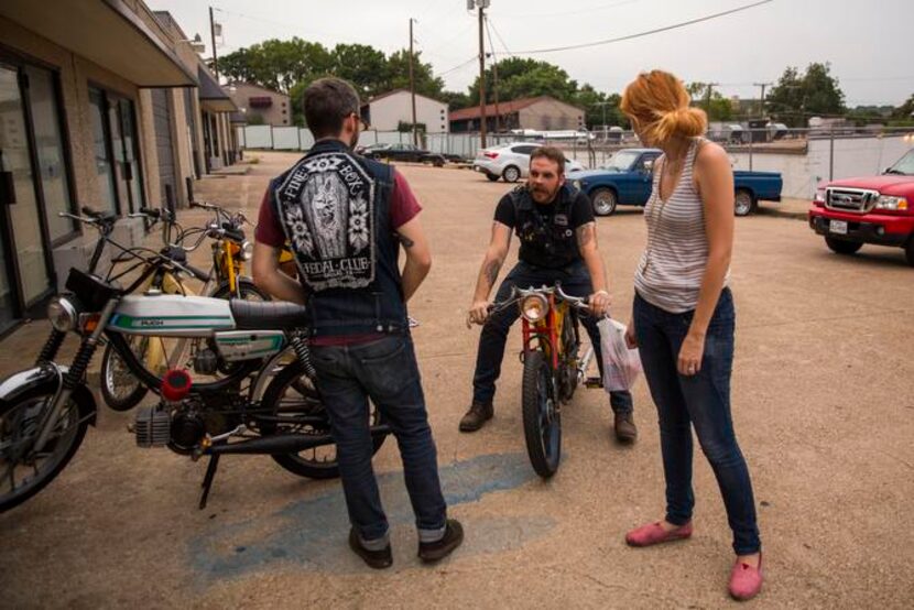 
Josh Lacheney, center, returns from ordering food at Tacos La Banqueta Puro, a club...