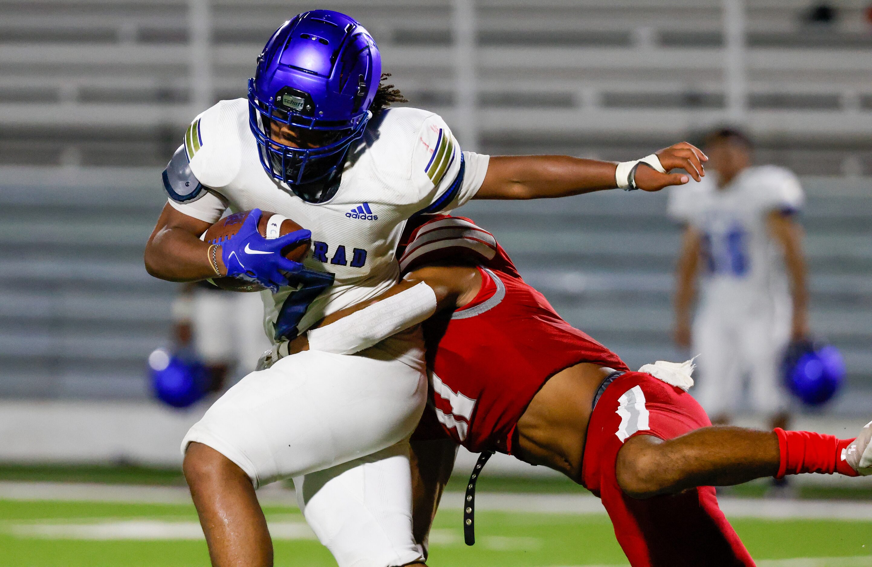 Conrad running back Ashton Ross (7) is tackled in the second half of a game against Woodrow...