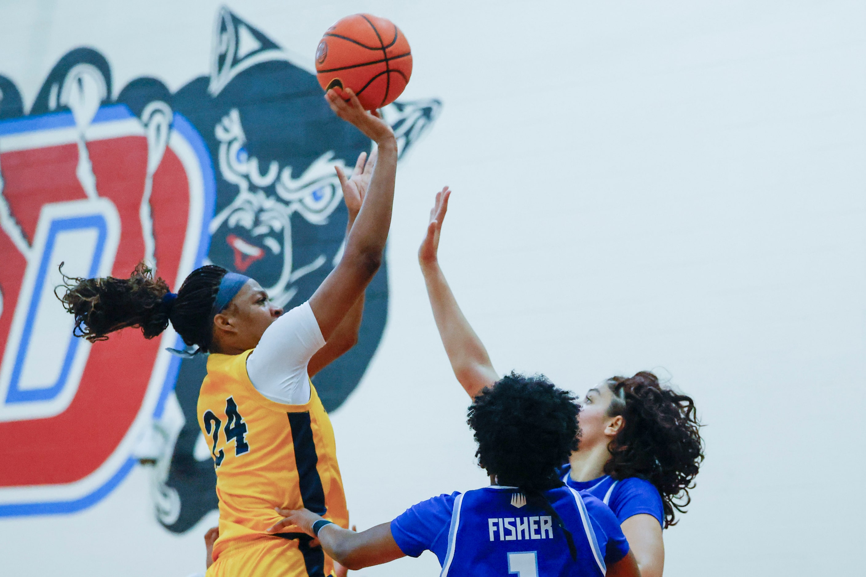 Oak Cliff Faith Family Academy’s Amari Byles (24) shoots over IMG Academy’s Kelis Fisher...