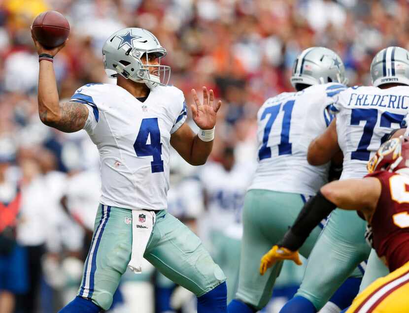 Dallas Cowboys quarterback Dak Prescott (4) looks to pass during the second half of play at...