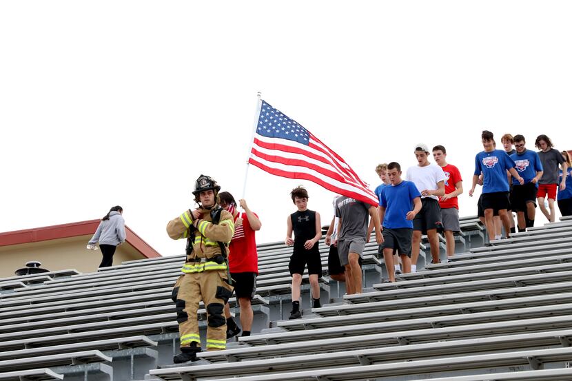 Grapevine High School's wrestling team paid tribute to 9/11 first responders last year on...
