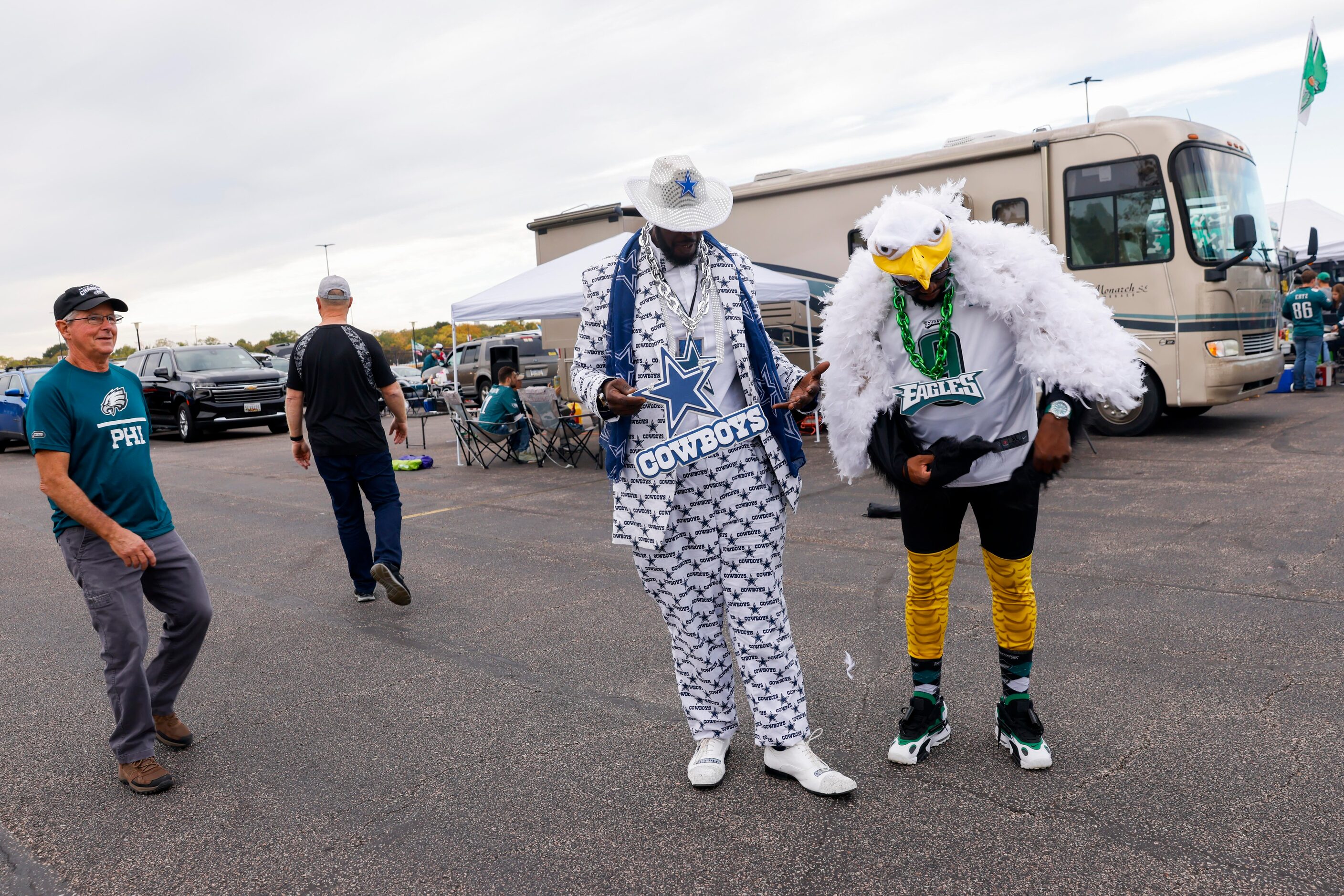 Brothers from Kinston, NC Corrie Koonce (center) and Albert Wiggans don their team’s looks...