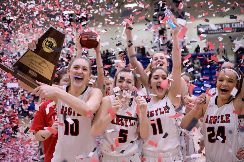 Argyle players celebrate a 52-37 win over Levelland in the Class 4A Region I final on...