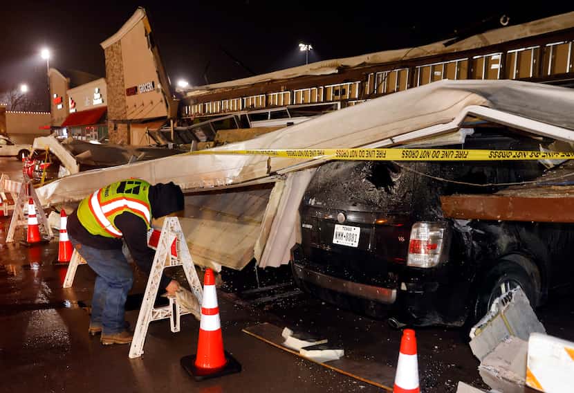 The roof of La Azteca grocery store on West Eldorado Parkway peeled off and landed on a...