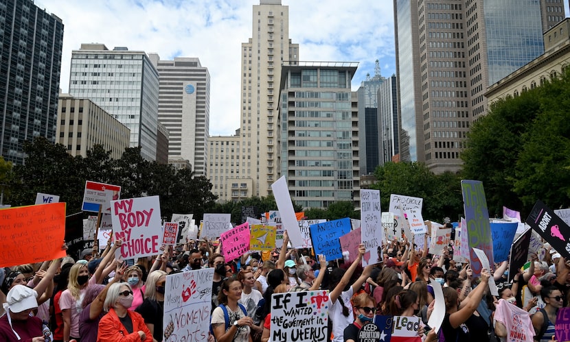 Saturday's marches in Dallas and across the nation came a day after the Justice Department...