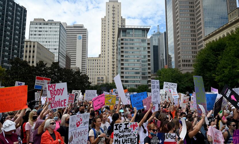 Saturday's marches in Dallas and across the nation came a day after the Justice Department...
