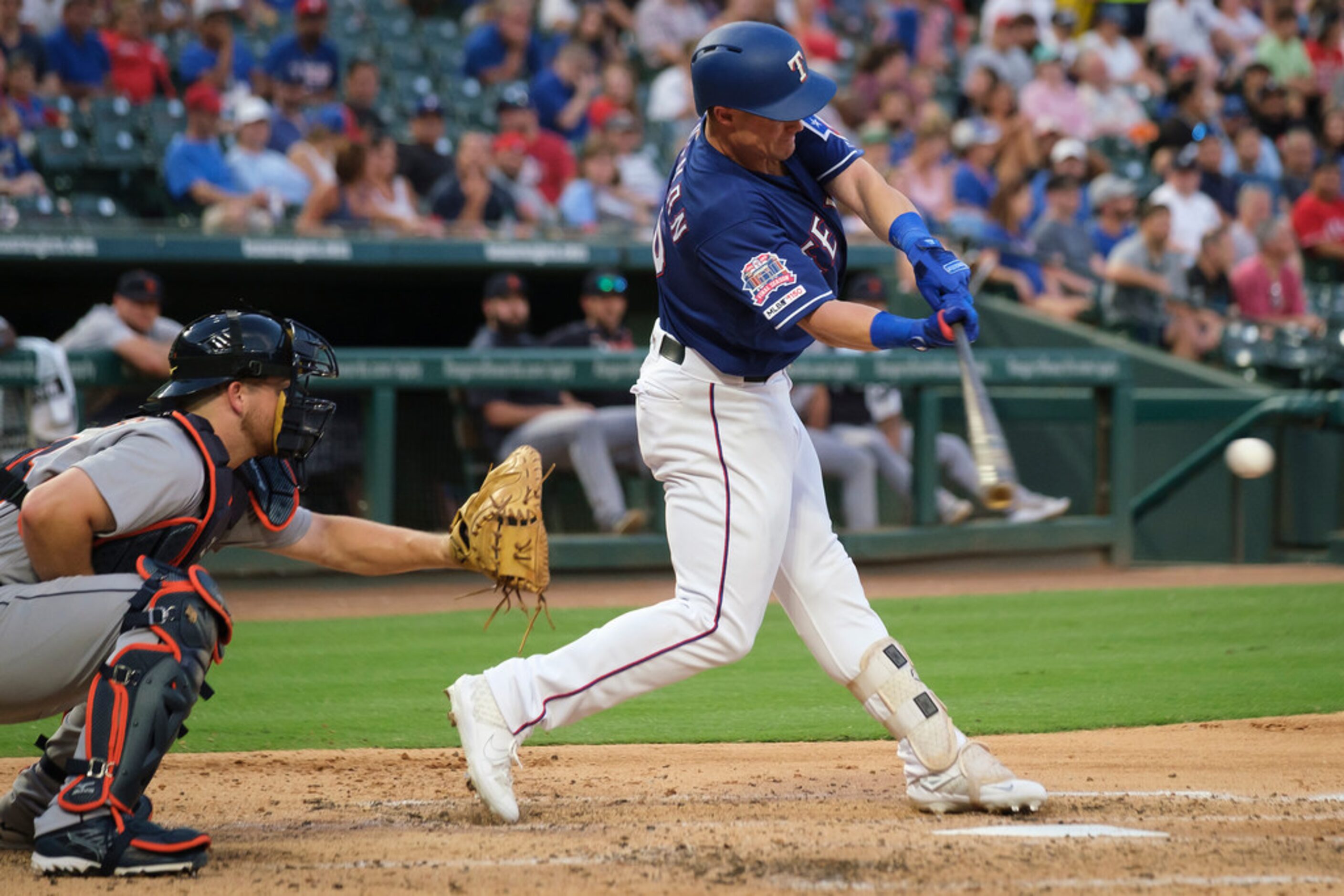 Texas Rangers outfielder Scott Heineman connects for his first major league hit, a single in...