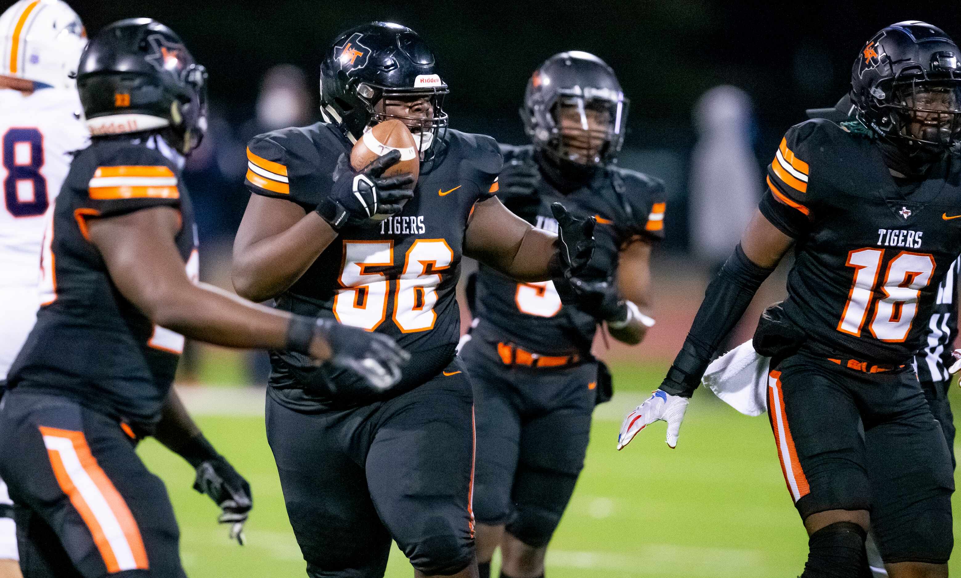 Lancaster junior defensive lineman Thomas Gort III (56) celebrates stripping and recovering...