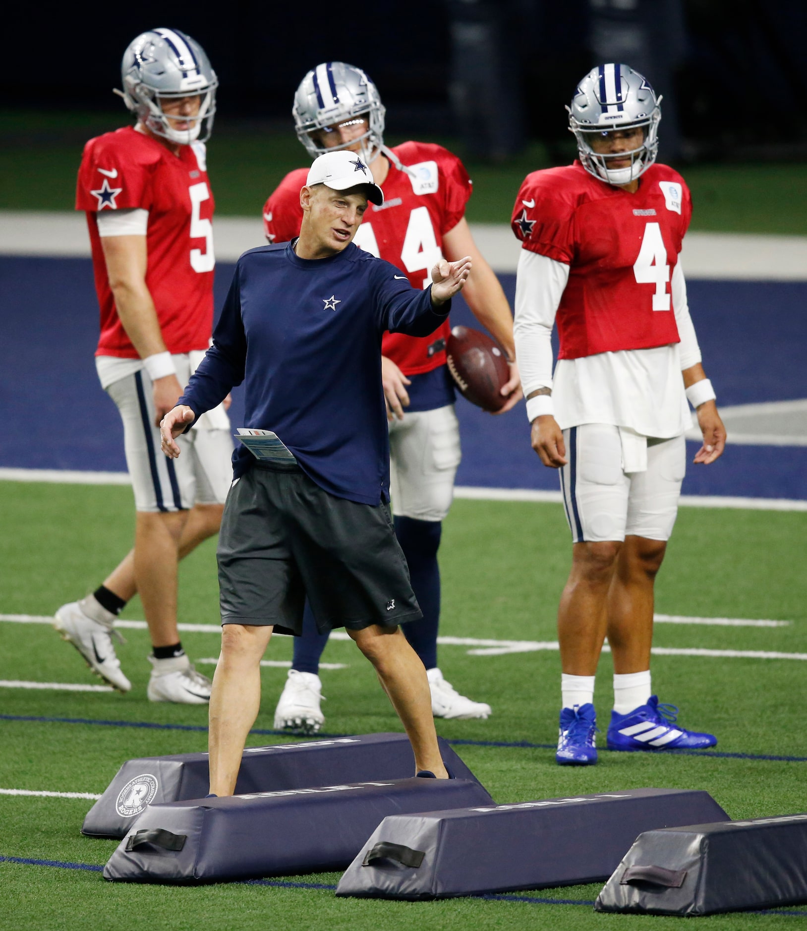 Dallas Cowboys quarterbacks coach Doug Nussmeier gives instructions on the next drill during...