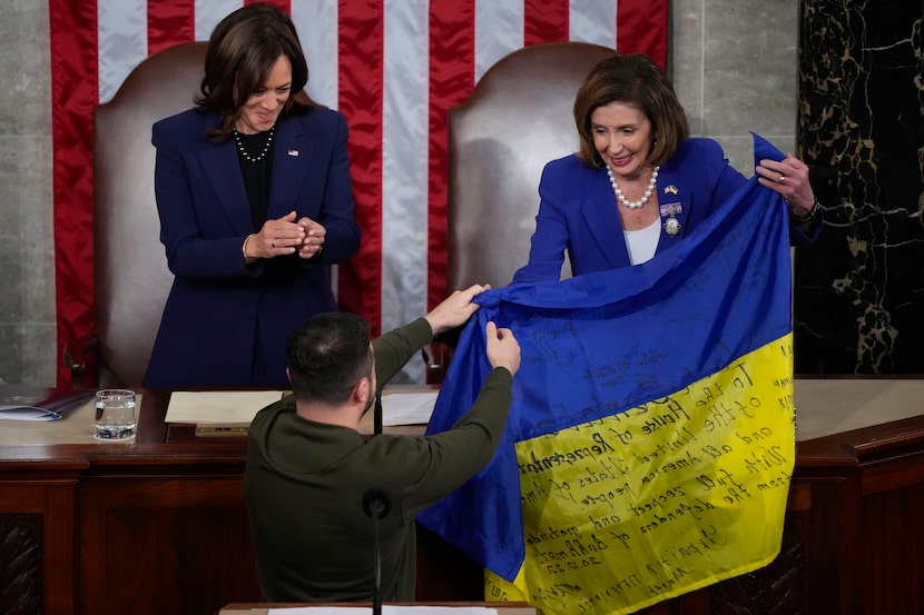 House Speaker Nancy Pelosi of Calif., right, and Vice President Kamala Harris, left, hold...