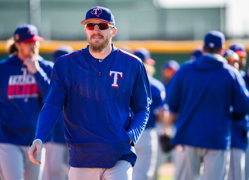 Texas Rangers relief pitcher Jake Diekman (41) walks to the next field during a spring...