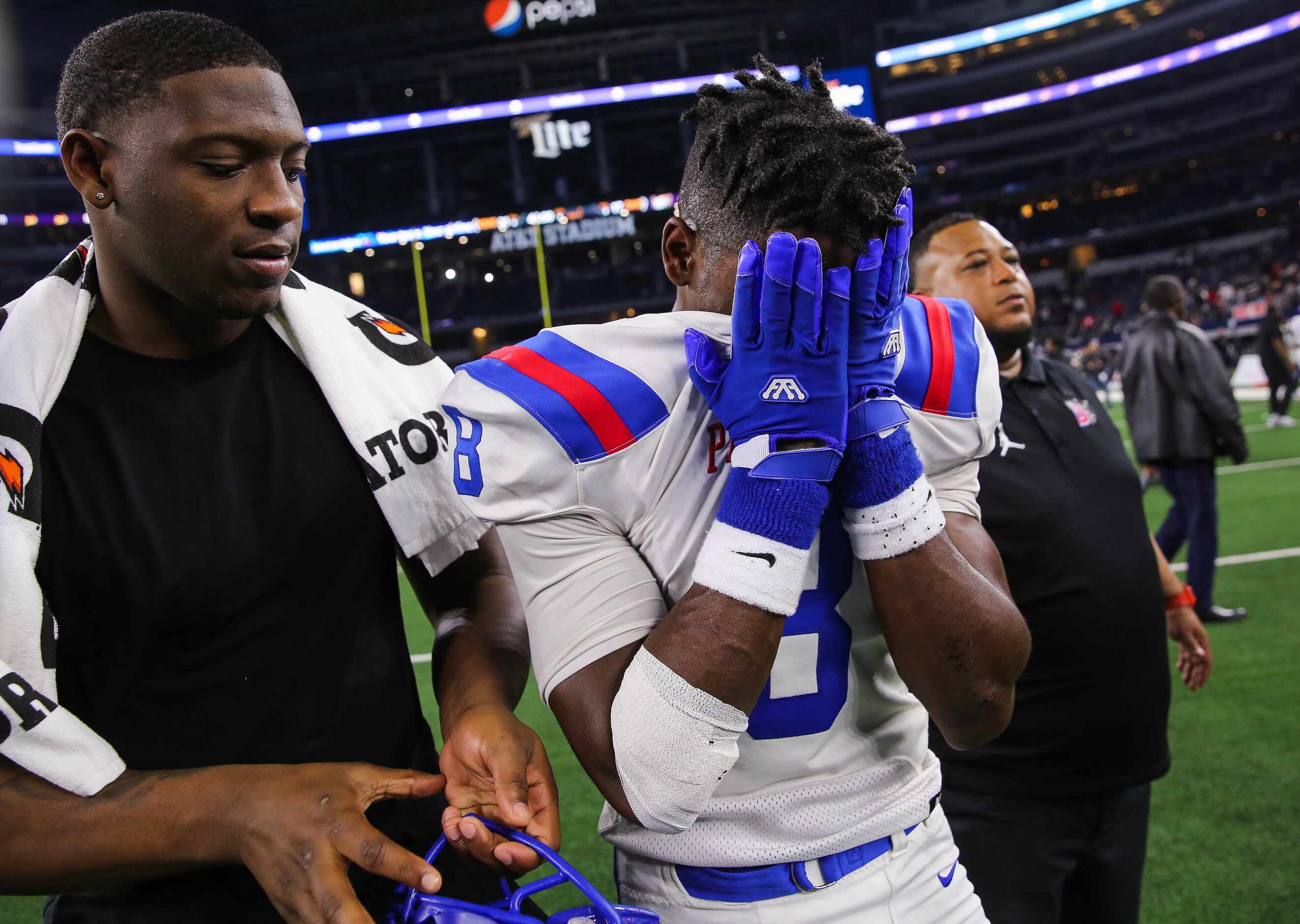Duncanville's LB Jadarius Thursby (8) is emotional after losing a Class 6A Division I state...