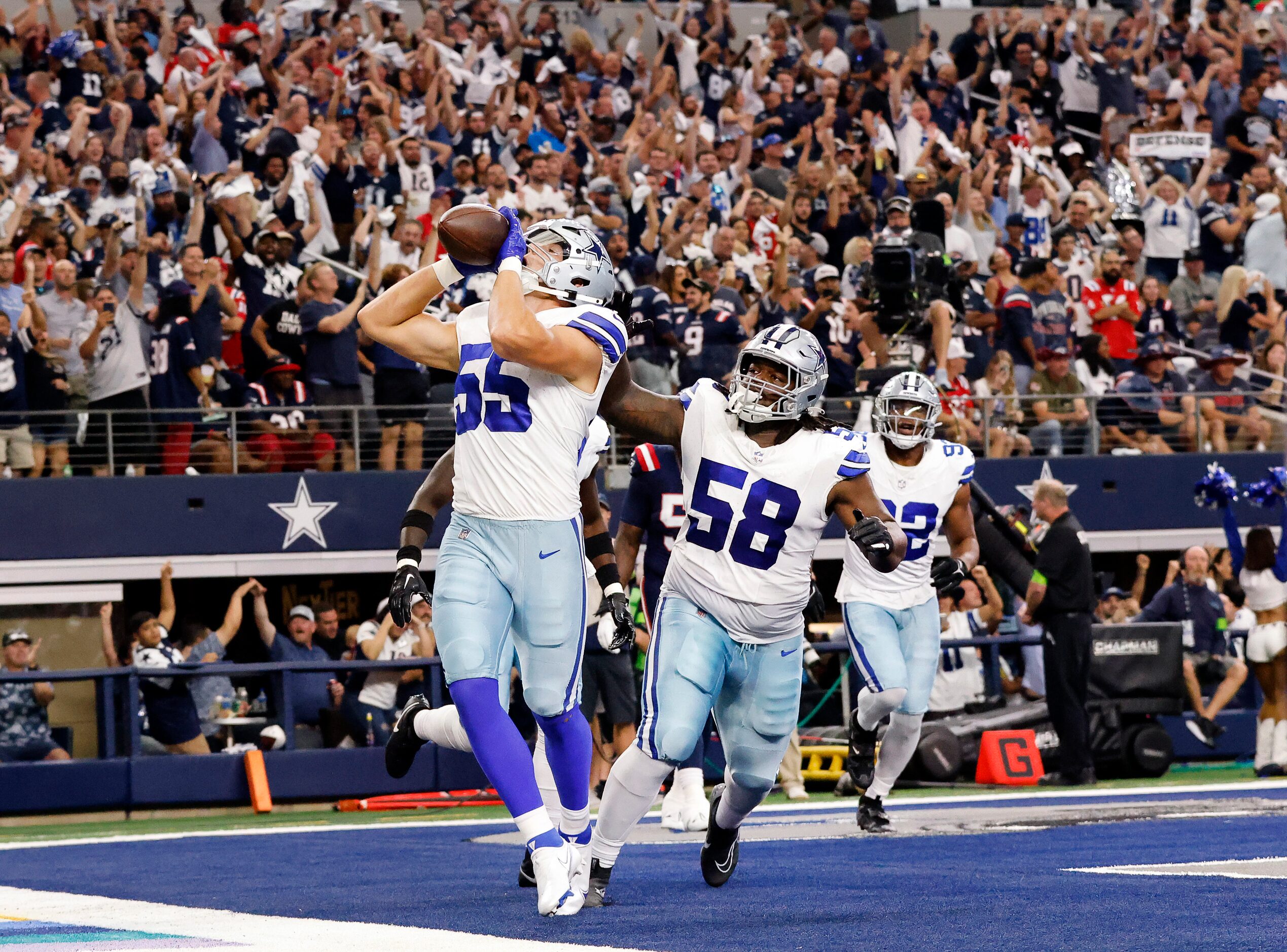 Dallas Cowboys linebacker Leighton Vander Esch (55) celebrates his scoop and score by doing...