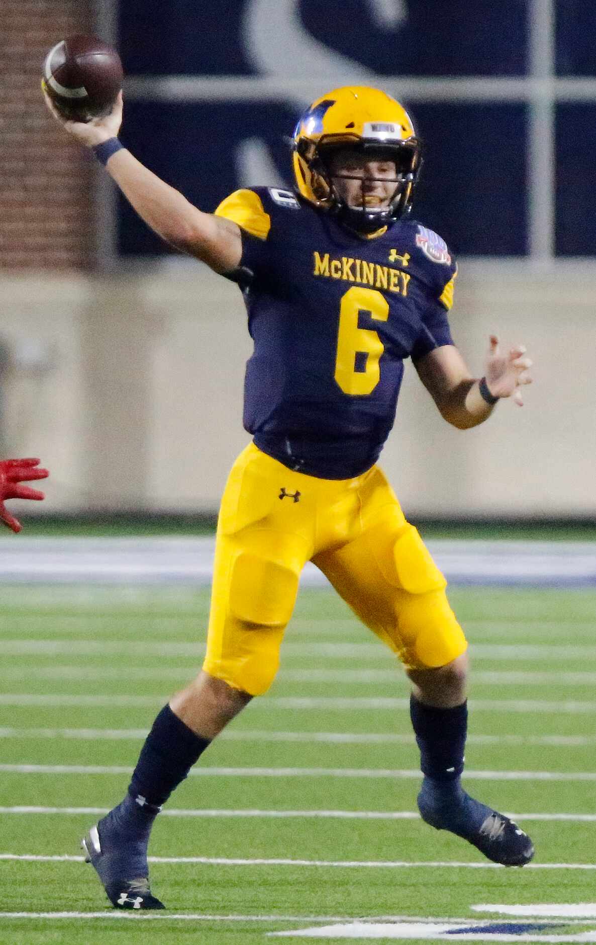 McKinney High School quarterback Sampson Nazarko (6)  throws a pass during the first half as...