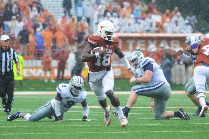 Oct 24, 2015; Austin, TX, USA; Texas Longhorns quarterback Tyrone Swoopes (18) carries the...