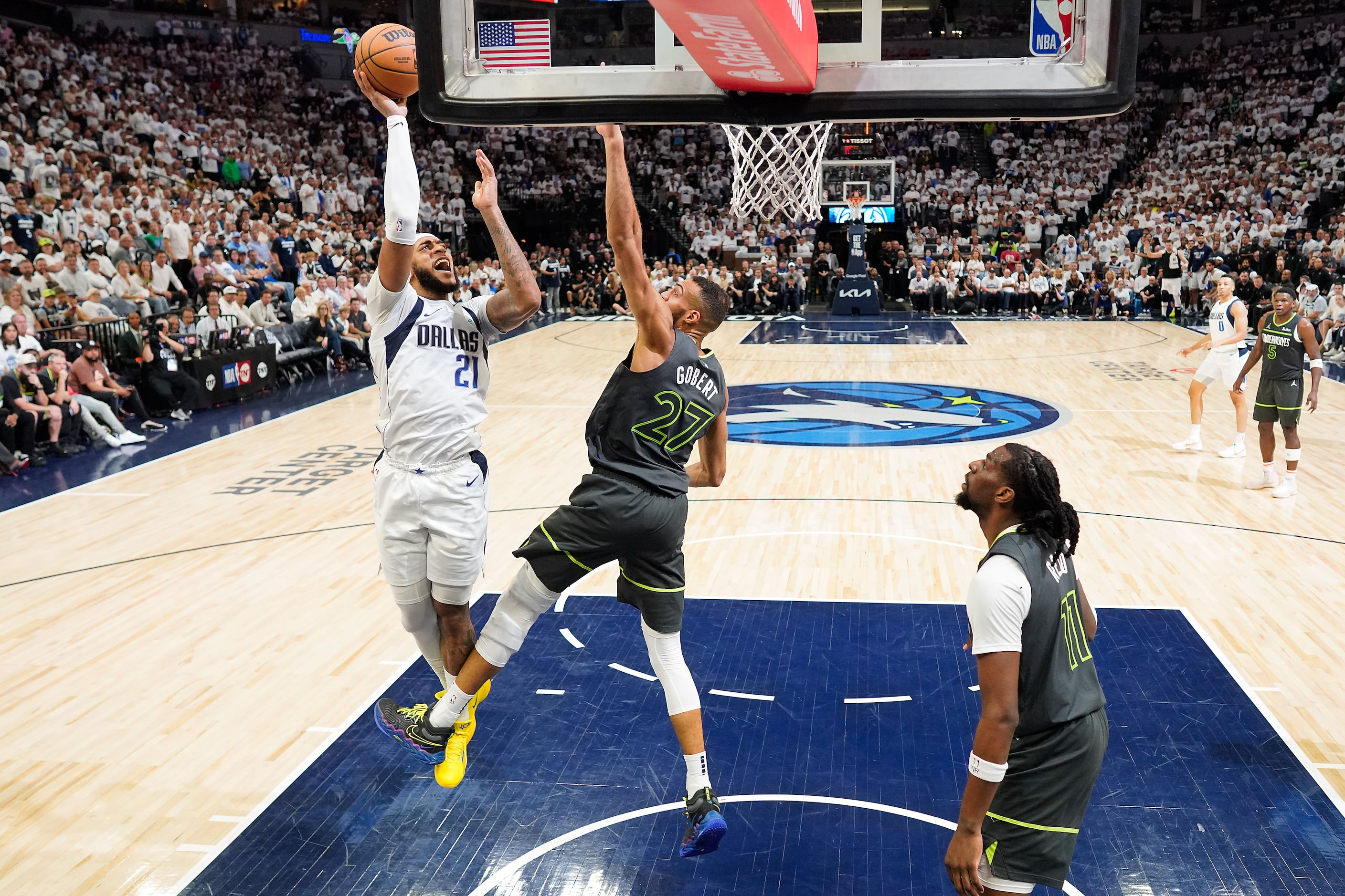 Dallas Mavericks center Daniel Gafford (21) scores past Minnesota Timberwolves center Rudy...