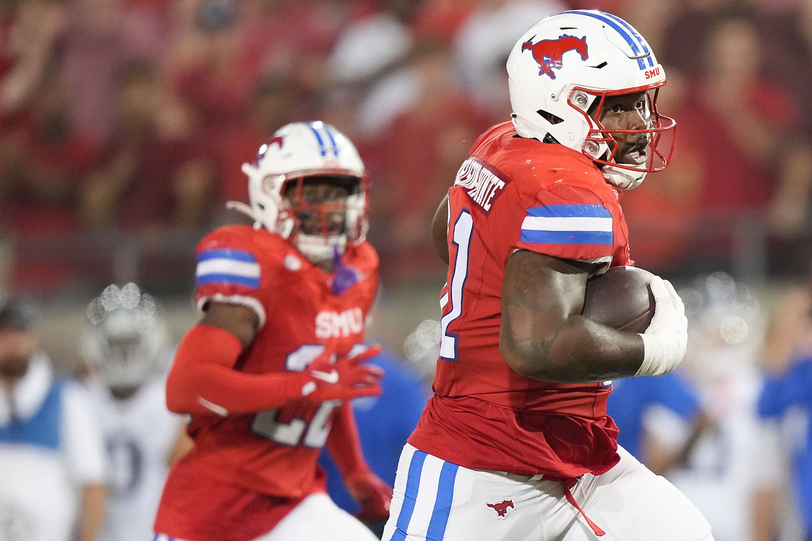 SMU defensive lineman Jared Harrison-Hunte (81) returns and interception during the second...