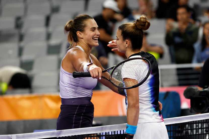 Maria Sakkari of Greece, right, greets Aryna Sabalenka of Belarus, after Sakkari won their...