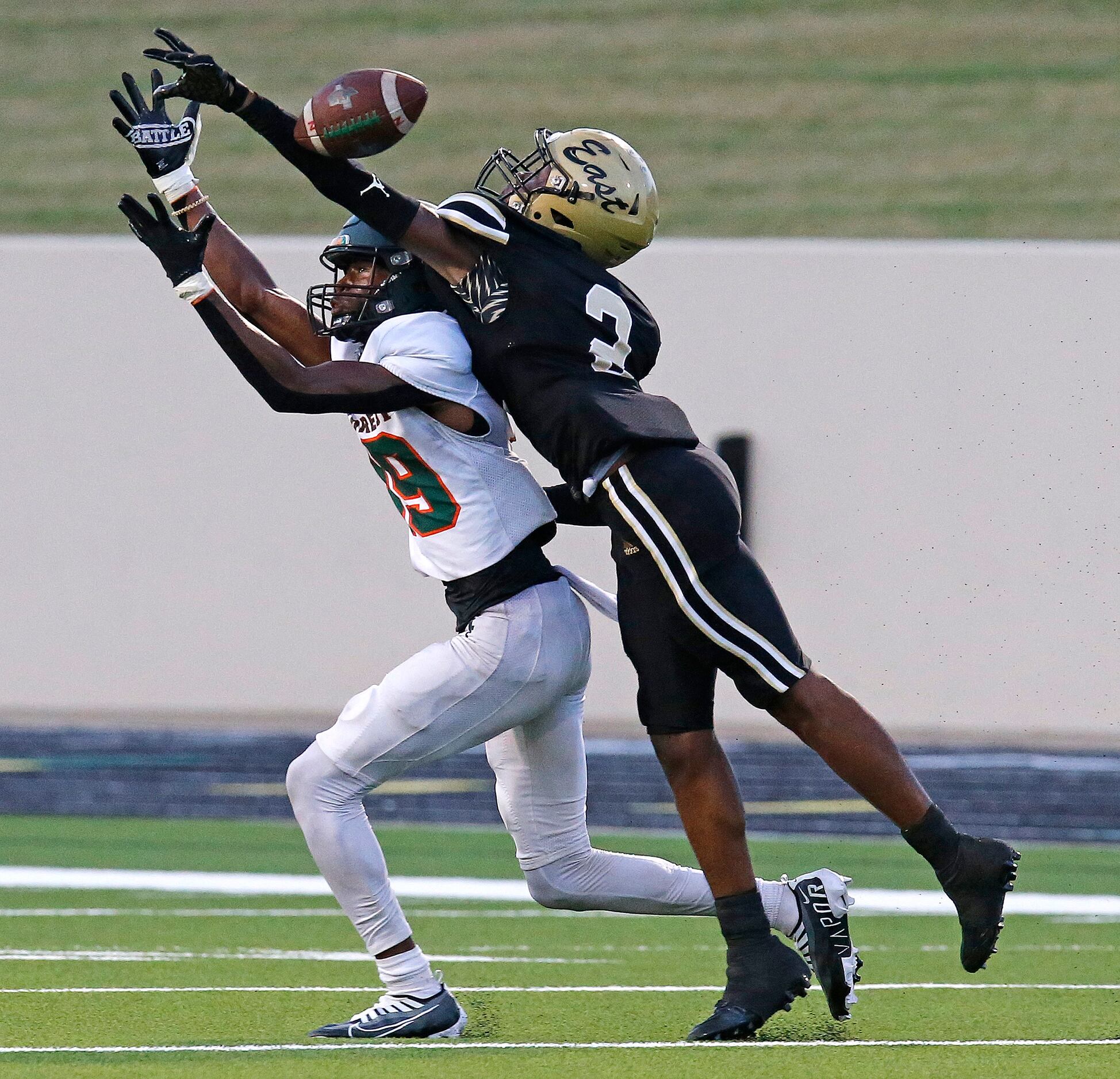 Naaman Forrest High School wide receiver Isaiah Wesley (19) got the interference call on...