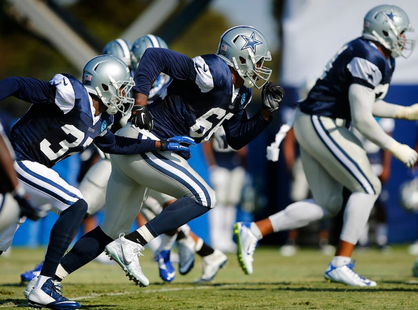 Dallas Cowboys defensive end Mike McAdoo (66) pass rushes the offense during afternoon...