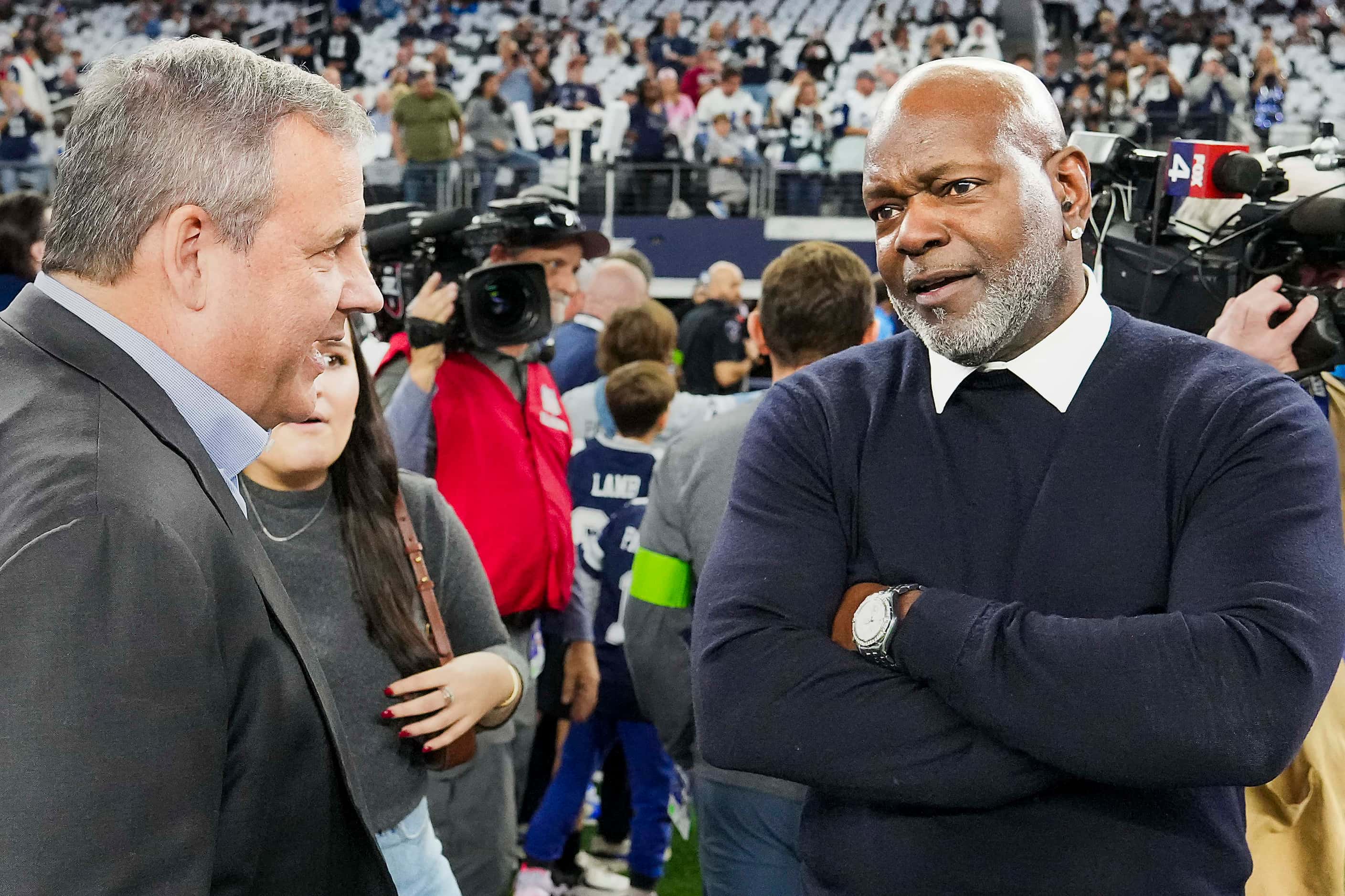 Former Dallas Cowboys player Emmitt Smith (right) talks with former New Jersey Gov. Chris...